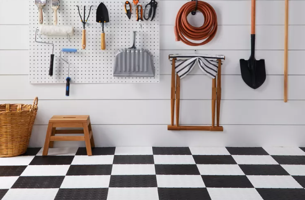 organized garage with tools on wall