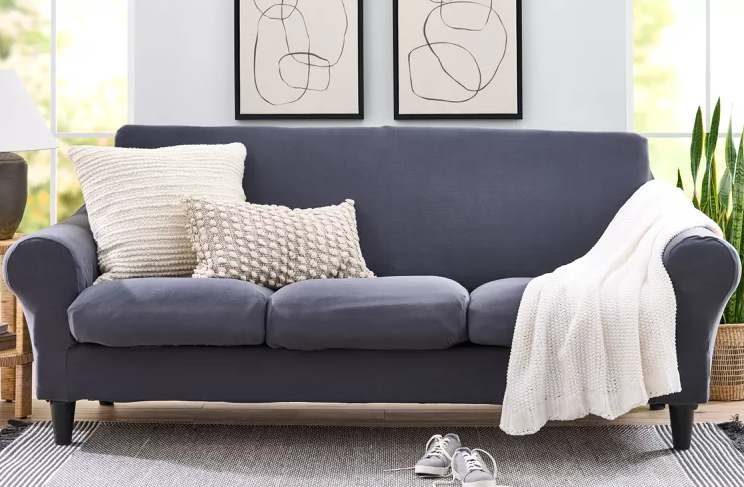 blue couch in living room with white walls